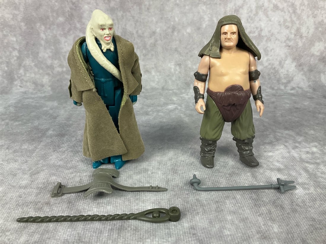 1980's Star Wars Action Figures: Lot of two made by LFL in Taiwan. 1983 Bib Fortuna complete with accessories and robe. Some wear to back of cape and the chest plate is sticky due to age. 1984 Rancor Keeper complete with hood and wea