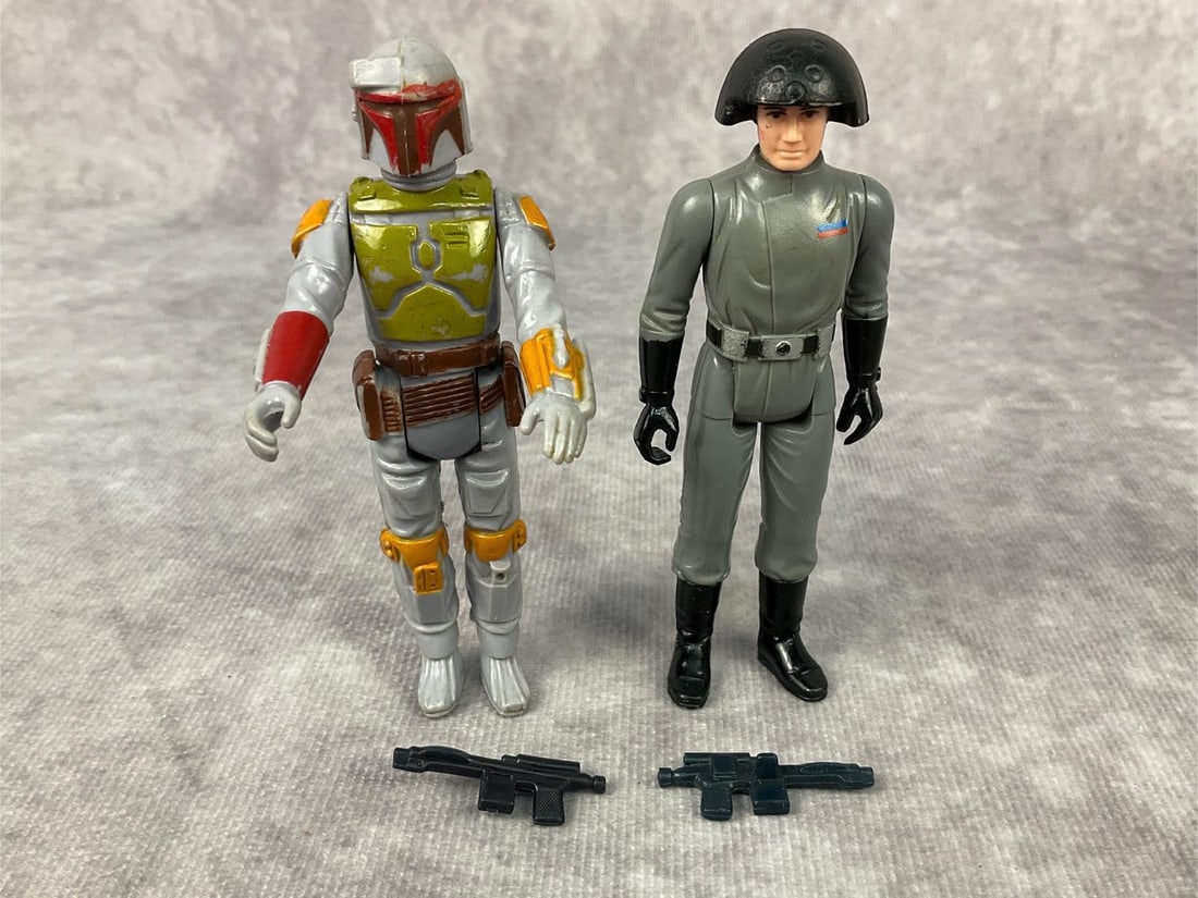 1970's Star Wars Action Figures: Lot of two made by CPG and GMFGI in Hong Kong. 1979 Boba Fett complete with accessories, paint wear throughout. 1977 Death Squad Commander complete with gun, paint wear to helmet, measures 3.75 inches