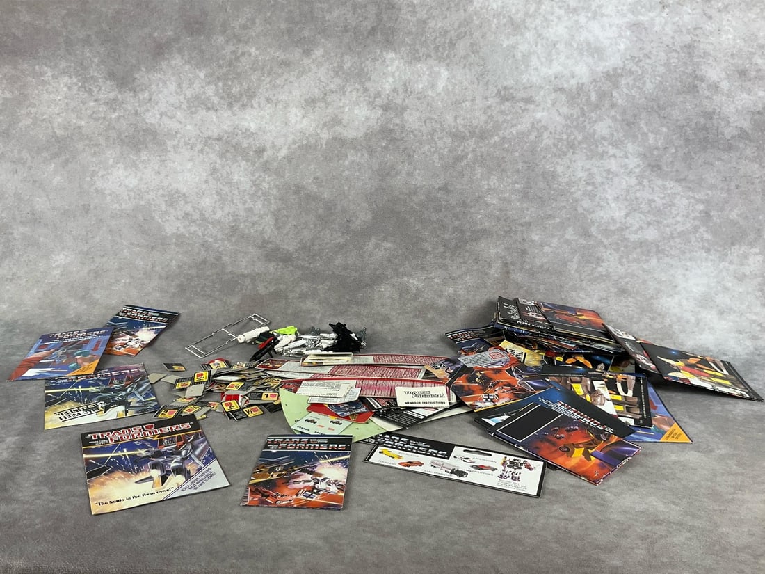 Transformers Posters & Parts: Large lot of transformer catalogs, label sheets, stickers, robot points, tech spec cards, replacement parts and more. All in good condition. Catalogs measure 4 inches wide x 5 inches tall.
