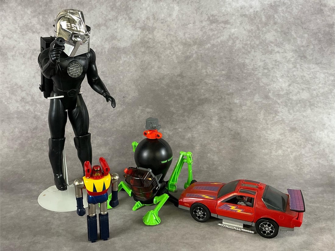 1980's Retro Toys: Group of four. 1978 Battlestar Galactica Cyclon figure, 1979 Mattel Shogun Warriors Poseidon die cast robot, 1982 Tommy Hoomdorm, and 1985 M.A.S.K Thunderhawk and Matt Trackker figure. All items are i