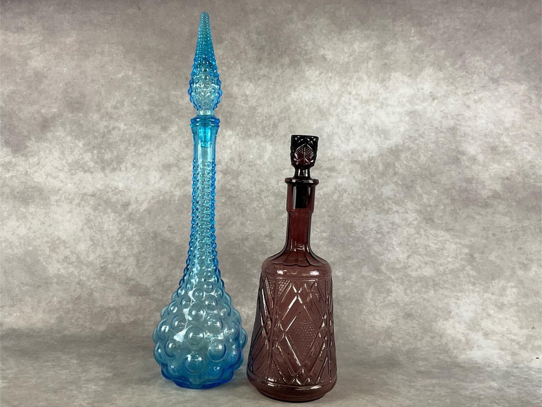 Colorful Decanters: 1970 Blue Empolo Glass Bubble decanter and an amber decanter. Both are in good condition with original stoppers. Blue decanter measures 20 inches tall.