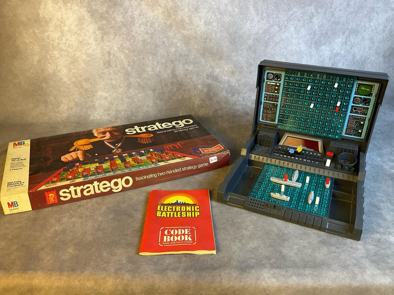 Electronic Battleship Game: Lot contains a 1982 Electronic Battleship game that appears complete has not been tested and is in good condition, and a 1970 copy of Stratego complete with some foxing on the box but overall in good 
