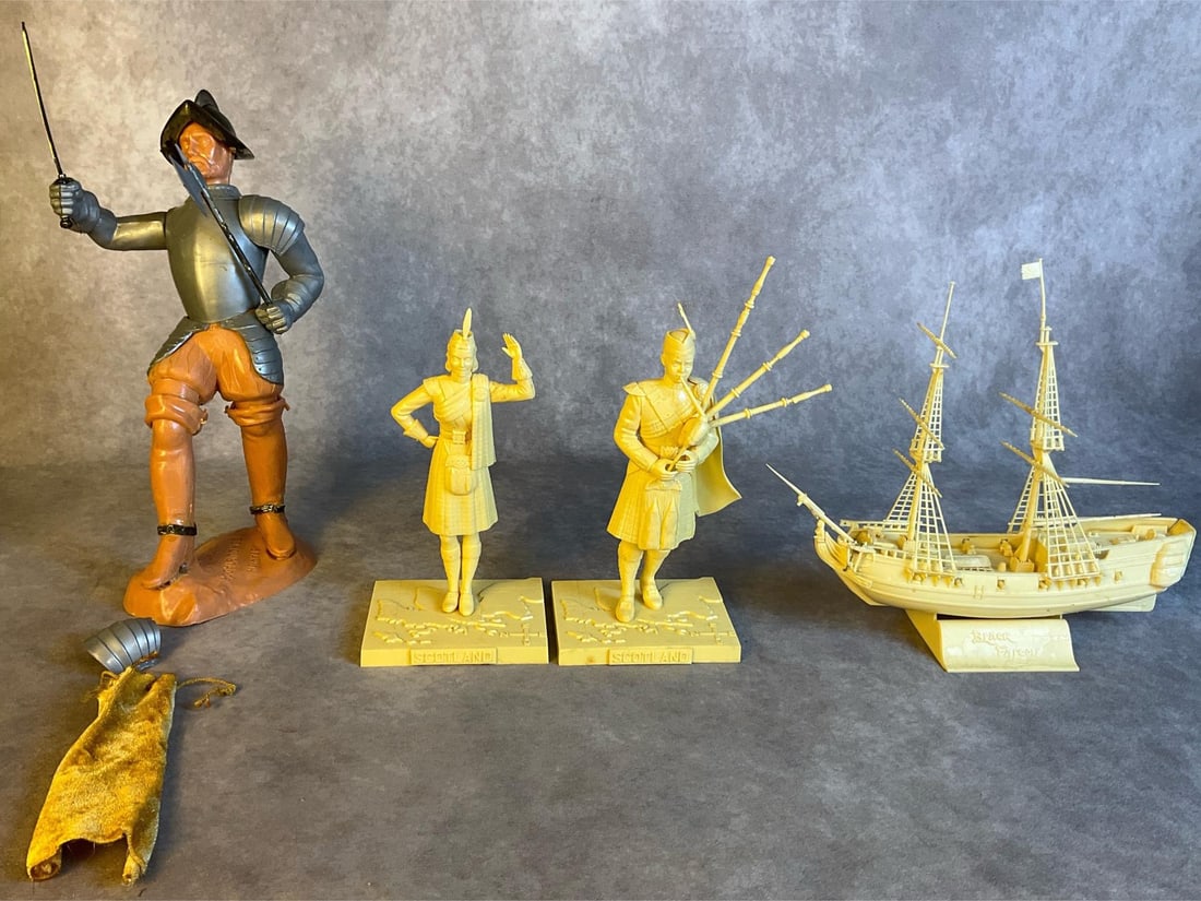 1950s Plastic Models: Lot contains two unpainted plastic models of a Scotsman and woman in traditional Scottish dress by Aurora Plastics both completely assembled and unpainted however the womans legs have come unglued but