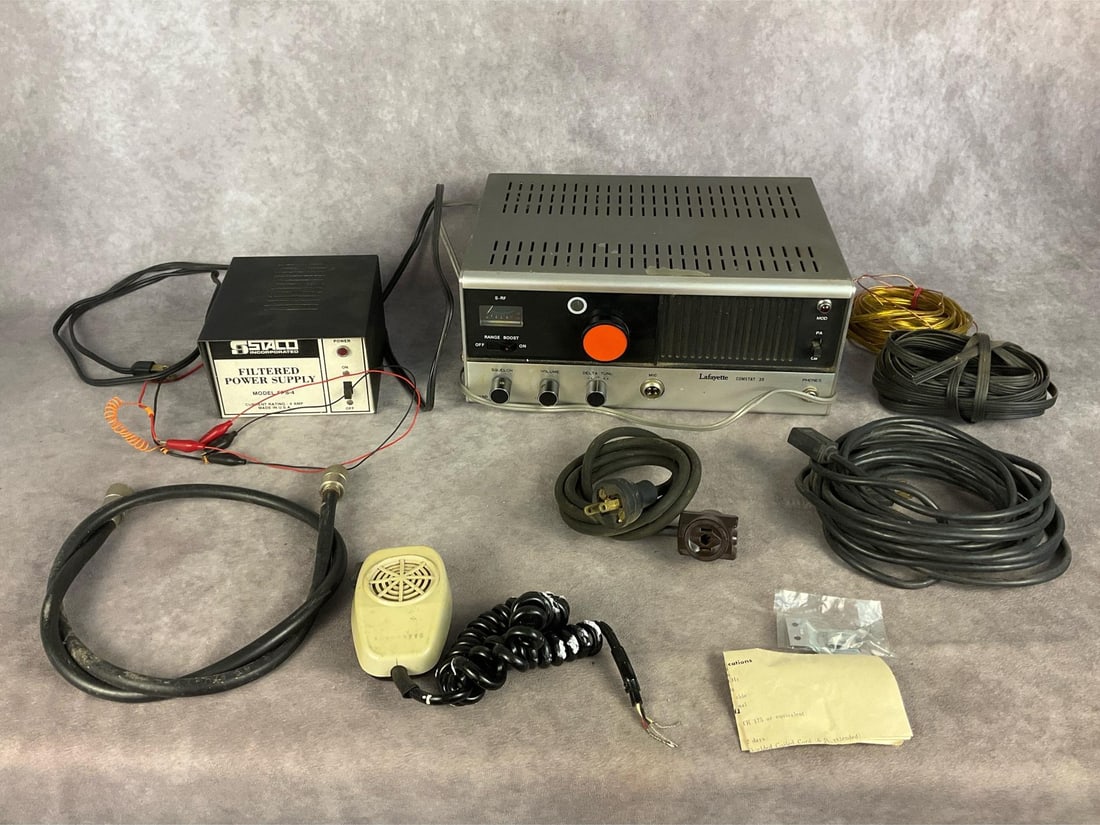 Lafayette CB Radio: Lot contains a Lafayette Comstat 35 CB radio that powers on but is not guaranteed to work, a Staco 4 AMP filtered power supply that powers on but is not guaranteed to work, a microphone missing a plug
