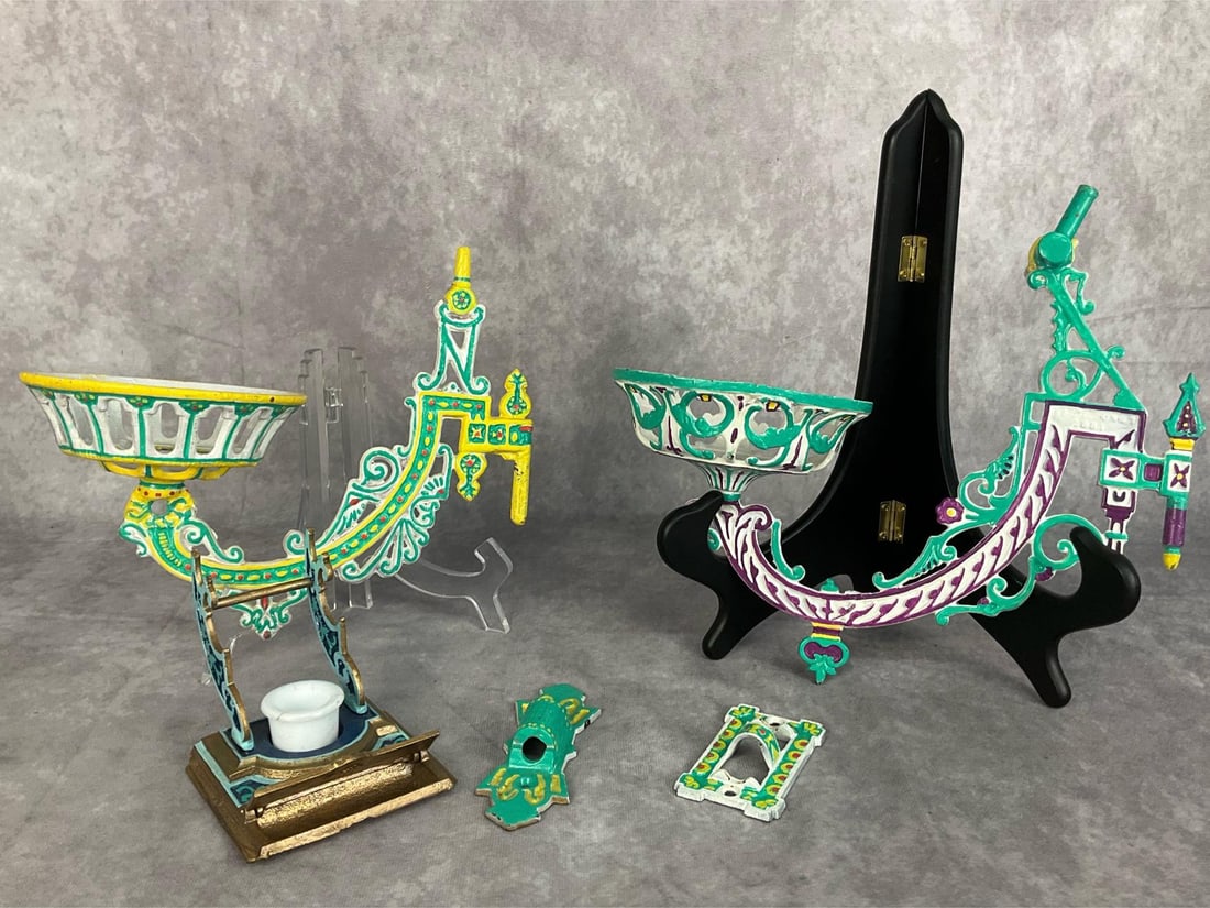 1930's Cast Iron Wall Brackets: Two wall brackets with hardware, and ornate candle stand. All items are painted. Good condition. Brackets measure 10 inches in length x 5 inches wide x 7 inches in height.