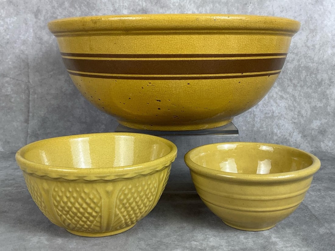 Yellow Ware Mixing Bowls: Mustard yellow large 12.5 inch mixing bowl with brown band, unmarked. Small 6 inch Robinson Ransbottom Pottery, Roseville OH, diamond pattern mixing bowl. Made in USA small 5.25 inch mixing bowl. All 
