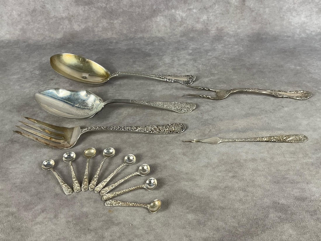 Misc. Sterling Silver Serving Utensils: Group of nine sugar spoons, two large serving spoons, two meat forks and one butter pick. All have tarnishing and scratches. Weighs 11.51 ozt