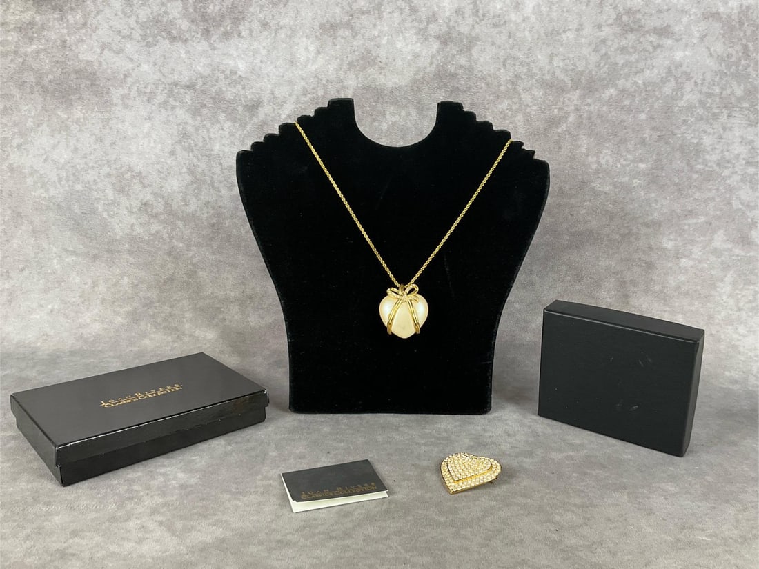 Joan Rivers Heart Brooch & Necklace: Both have papwork, necklace is in an unmarked box, but has pouch and paperwork. Heart pendant on necklace is in fair condition. Brooch measures 2 inches wide.