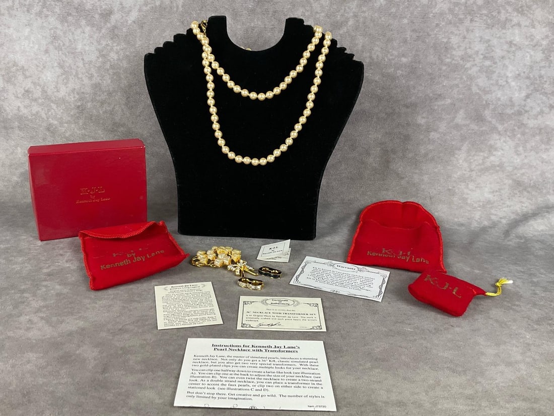 Kenneth Jay Lane Pearl Jewelry: One simulated pearl necklace, one brooch and two transformers. All with pouches. Necklace has the box, the brooch and transformers do not. Comes with paperwork pictured. Brooch measures 3 inches long 