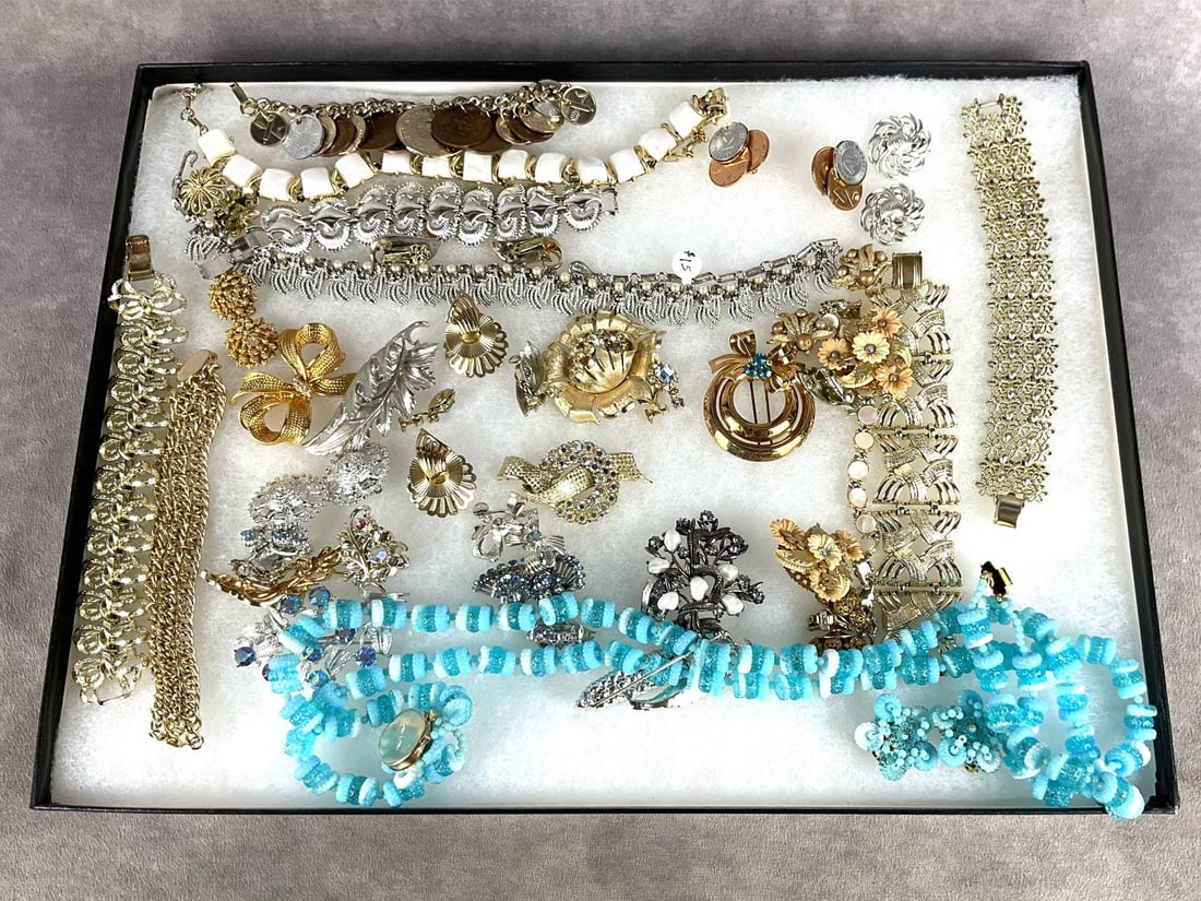Beaded Costume Jewelry: Large assortment of beaded costume jewelry. Mostly Coro brand. All items are in good condition, some may be missing stones or have loose stones. Displayed in riker box. Box measures 16 inches wide x 1