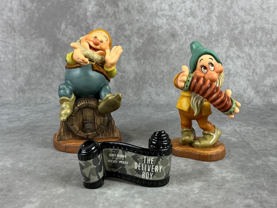 Walt Disney Classics Collection Figures: Includes an early 2000s Snow White Happy Thats Me figure, an early 2000s Snow White Aw Shucks figure, and a mid 1990s The Delivery Boy opening title figure. All boxes have some creasing and the title 
