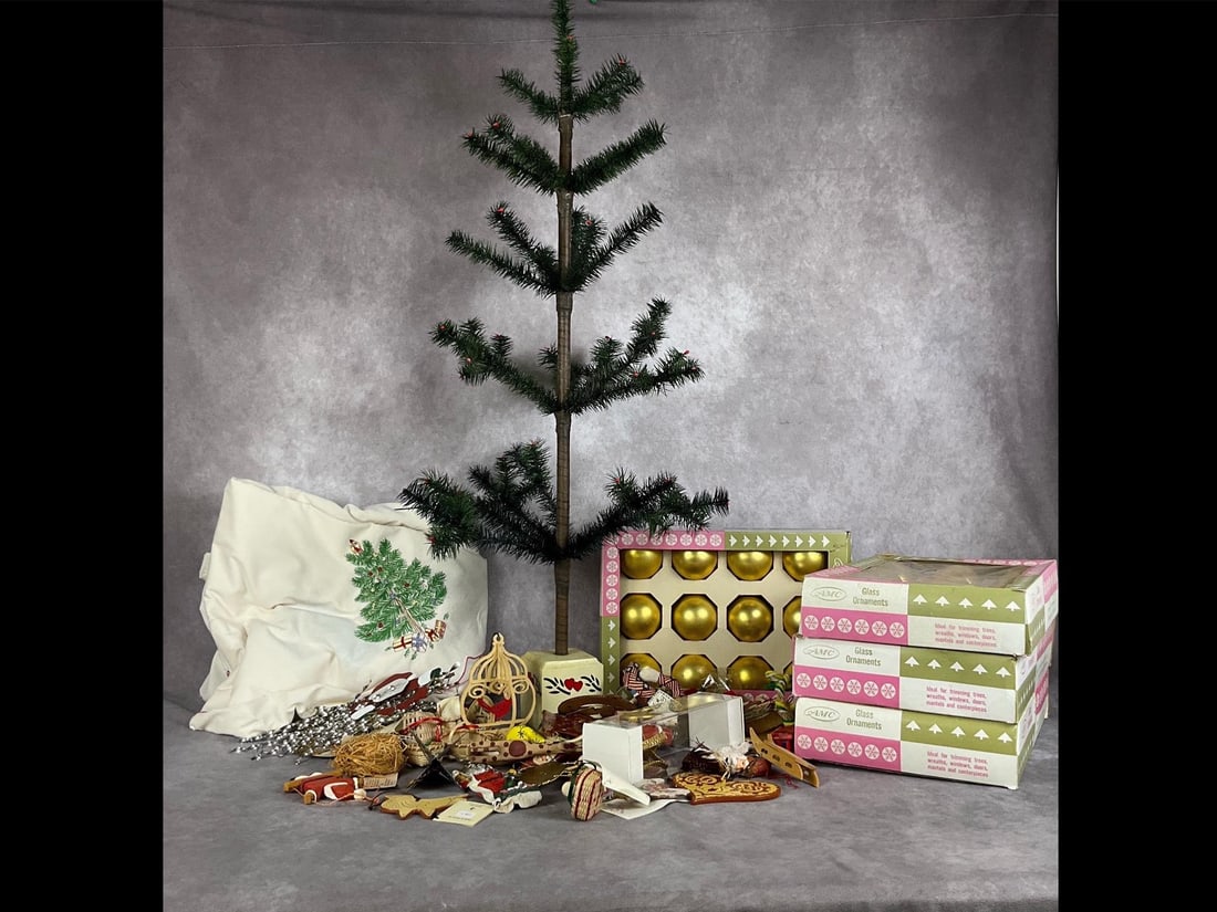 Folk & Vintage Christmas: Folk art tree with a large assortment of handmade and handwoven ornaments, four boxes of AMC glass vintage gold balls, and one embroidered tablecloth. All items are in good condition. Tree measures 16