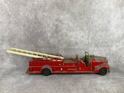 No. 520 Hubley Fire Dept Metal Fire Truck: 1950s toy fire truck. Heavy paint loss and wear. Measures 21 inches wide x 4.5 x 4 inches tall.