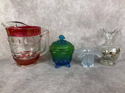 Art Glass Vases & More: Sowerby Tyreside vase, crackle glass vase with applied floral detail, carnival glass grape pattern candy dish, and a Kings Crown cranberry flashed pitcher. All in good condition with minor paint loss