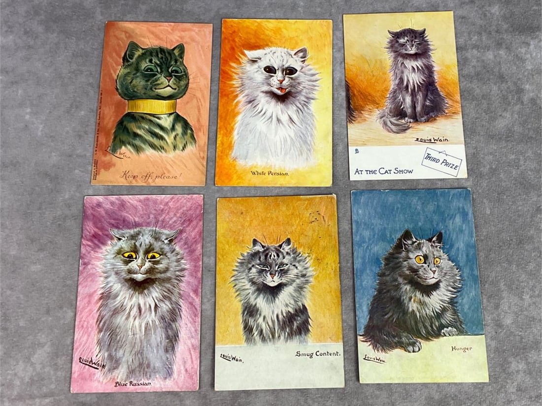 Louis Wain Postcards: Lot of six Louis Wain postcards featuring anthropomorphic cats. Circulated and non, all in plastic sleeves. Each measures 5.5 inches wide x 3.5 inches tall.