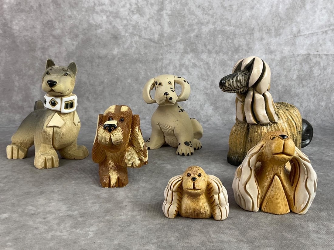 Artesania Rinconada Lot: Lot of six Artesania Rinconada dog figures. All in good condition. Largest measures 4 inches wide x 4.75 inches tall.