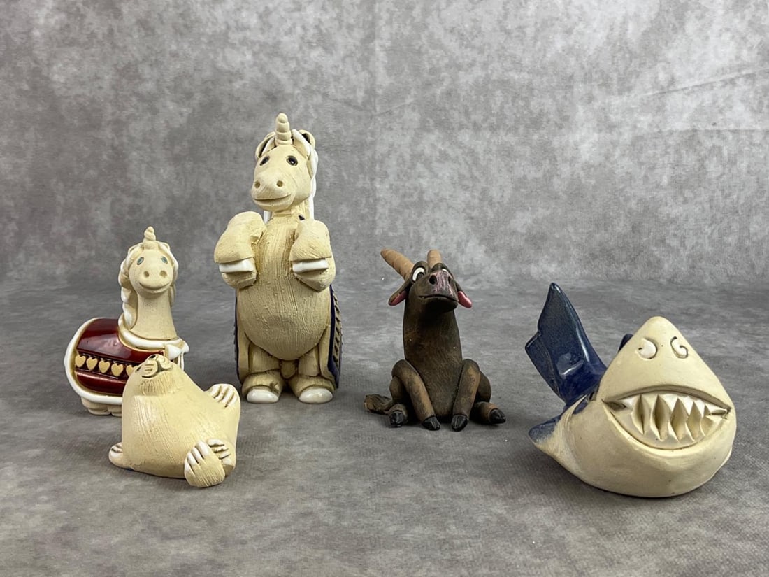 Artesania Rinconada Lot: Five Artesania Rinconada ceramic wildlife sculptures of unicorns, shark, seal, and goat. All in good condition. Large unicorn measures 2 inches wide x 5 inches tall.