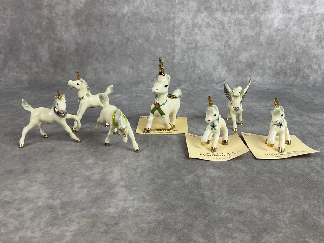 Hagen Renaker Unicorns: Lot of seven Hagen Renaker miniature figures including unicorns and a pegasus. All in good condition. Largest unicorn measures 2 inches wide x 3 inches tall.
