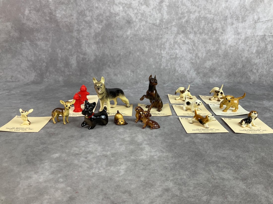 Hagen Renaker Dogs: Lot of sixteen Hagen Renaker miniatures including a variety of breeds and two fire hydrants. All in good condition. German shepherd measures 2 inches wide x 2.25 inches tall.