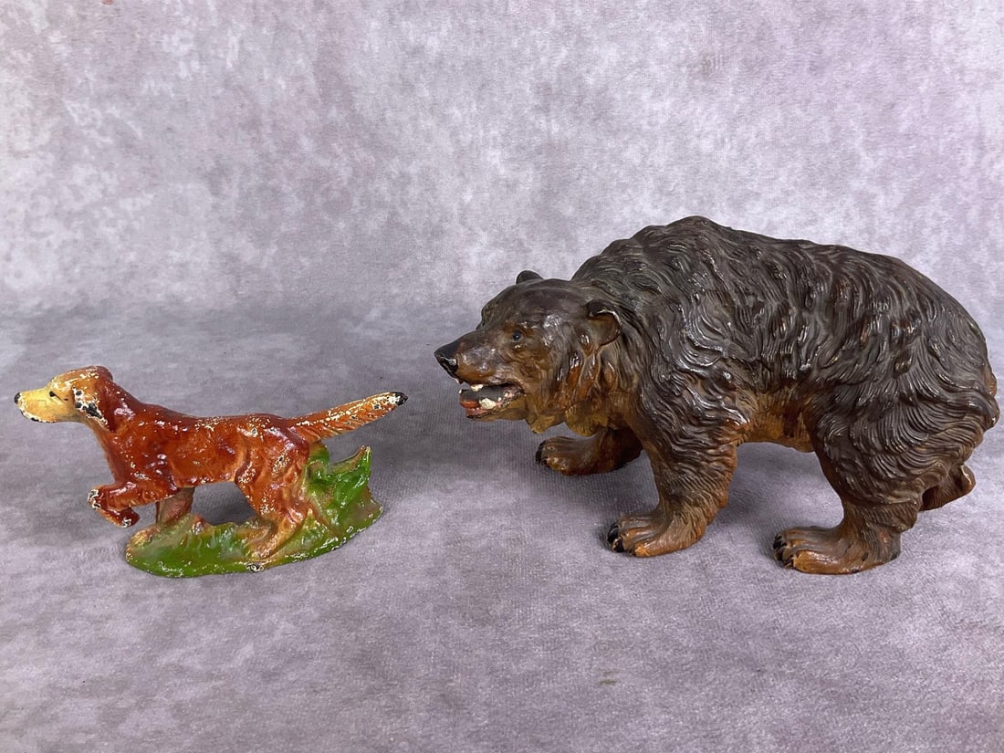 1940's Metal Figures: One bronze painted bear, likely made in Vienna. One Irish Setter made of cast iron and stamped John Wright, Inc 1947 on bottom. Both in fair to good condition with paint loss. Bear measures 7 inches w