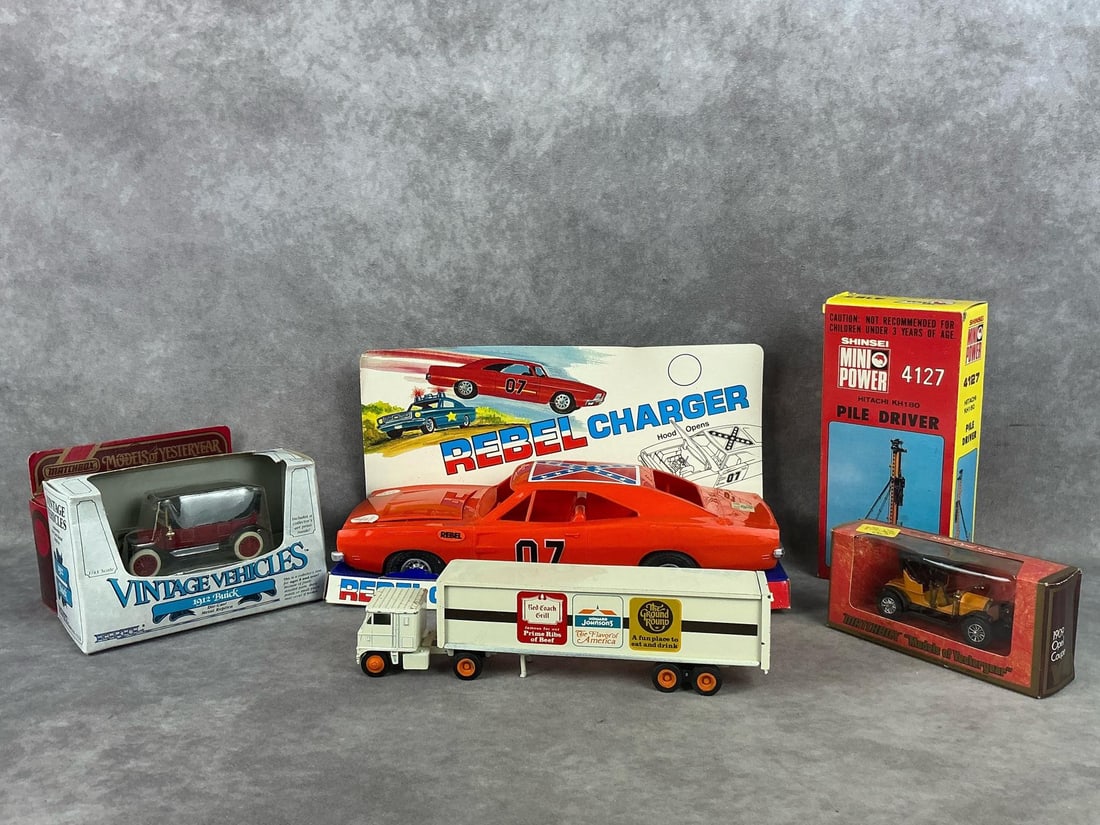 Matchbox Models of Yesteryear & More: Two Matchbox Models of Yesteryear, one ERTL Vintage car, a Shinsei Pile Driver, a Rebel Charger, and a Winross truck. All are unopened besides the Winross truck. The Rebel Charger Measures 13 inches w