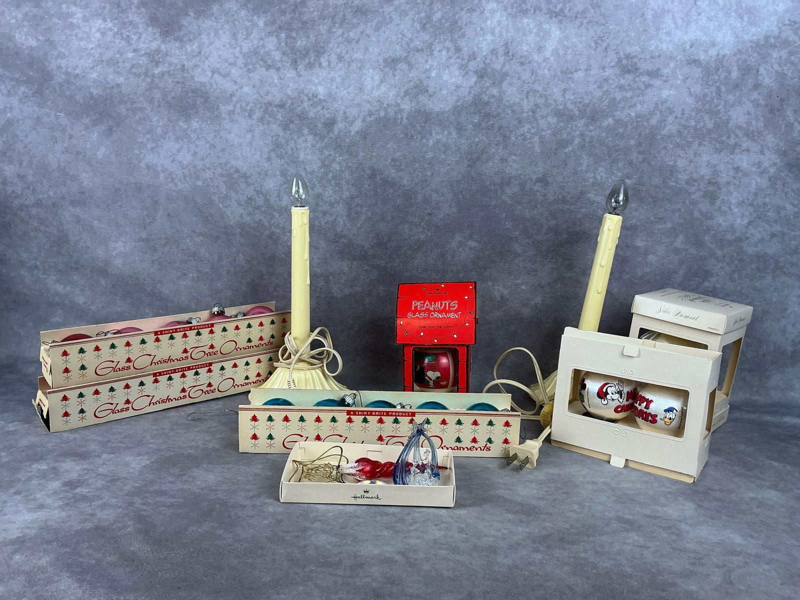 Vintage Christmas Group: Large group of Shiny Brite small bulbs in the box, Peanuts and Disney silk ornaments. All in good condition. Candlesticks work properly, but need new bulbs. Shiny Brite boxes measure 10.5 inches wide