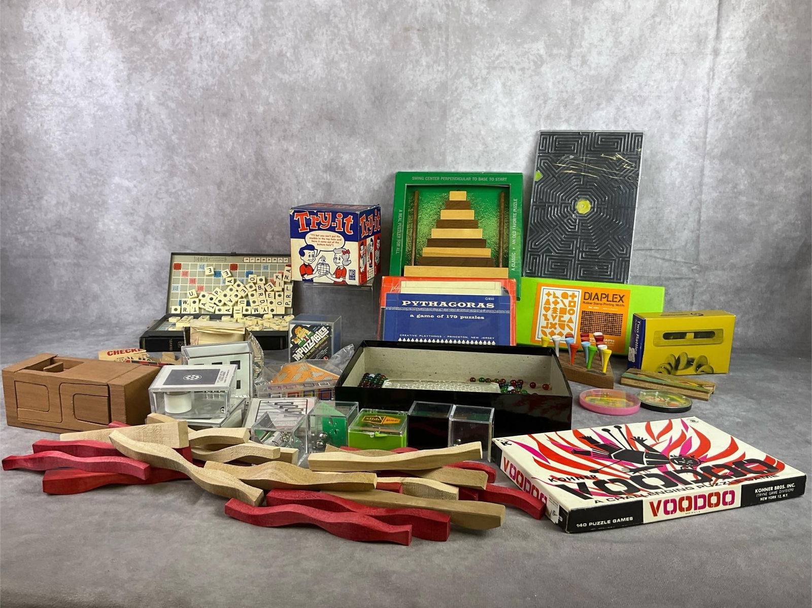 Vintage Puzzles & Brain Teasers Lot COMMAS?!: Collection of over 20 puzzles, brain teasers and toys. 1960 Milton Bradley Try-It Puzzle in original box. Standard Toykraft Mosaic Outfit toy. Creative playthings rattle toy in box. Puzzles appear com