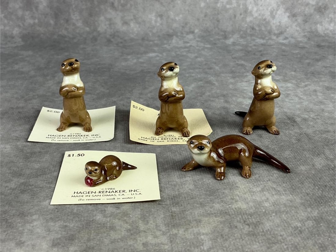 Hagen Renaker River Otters: Lot of five Hagen Renaker river otters. All in good condition with most on the original paper. Largest measures 1.25 inches wide x 2 inches tall.