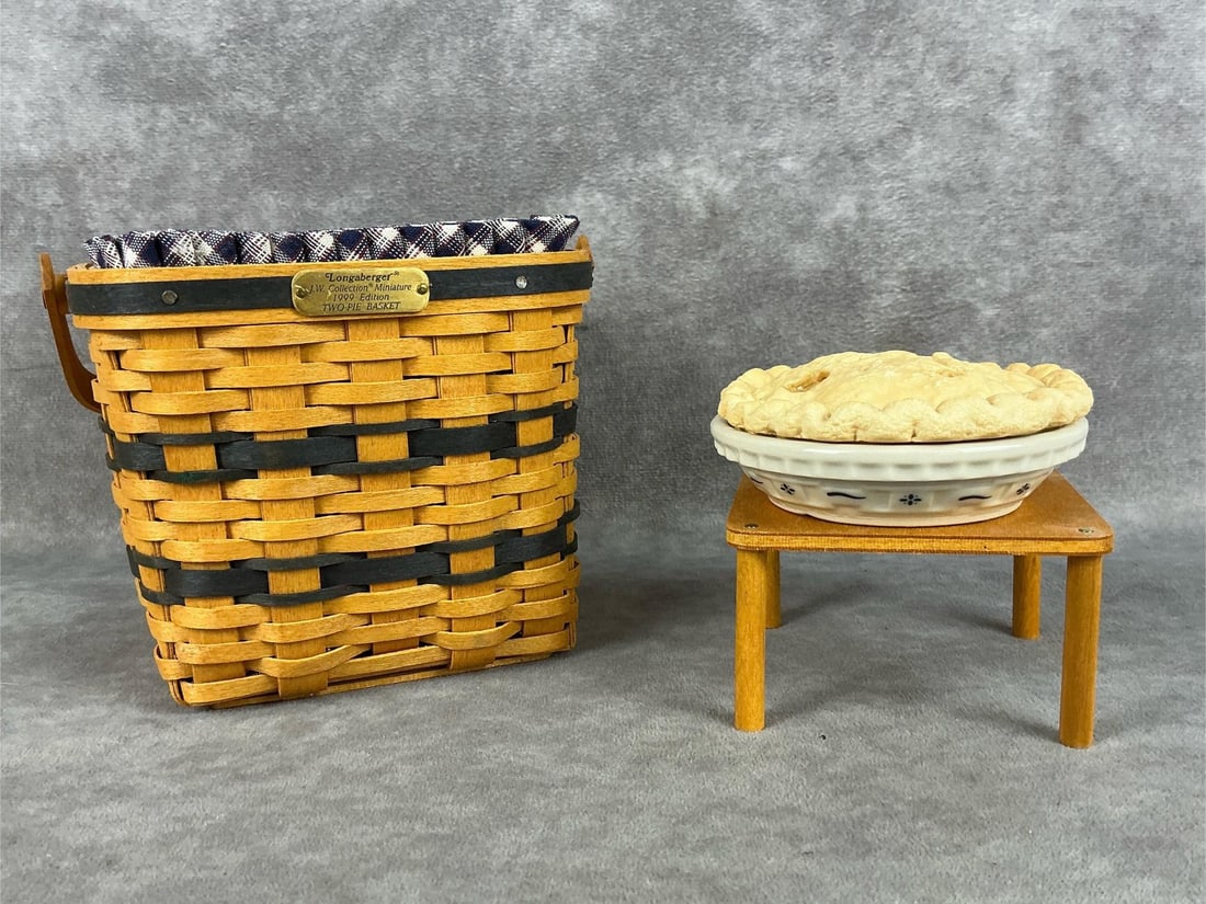 Longaberger Collector's Club Two Pie Basket: 1999 Two pie basket complete with liner, plastic liner, table, miniature pie plate and ceramic pie. All in good conditon with box sealed COA. COA envelope has a residue to the back. Pie basket measure