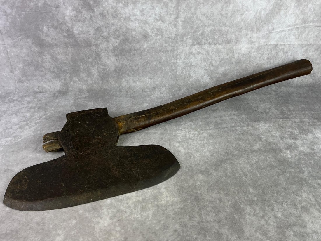 1800s American Axe: 1800s American Broad Axe single beveled with rounded blade made by a blacksmith. Handle is split down the middle. Axe measures 8.25 inches wide x 25.5 inches tall.