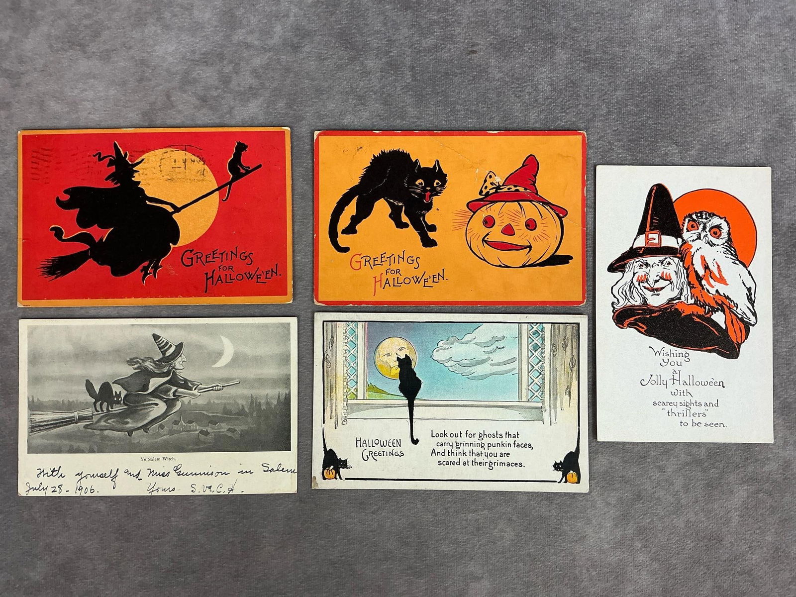 Halloween Postcards: Five early 1900s Halloween postcards. Two have been circulated, one undivided back. Soft corners, creasing, and staining present. All come in a protective plastic sleeve, each measures 5.5 inches long