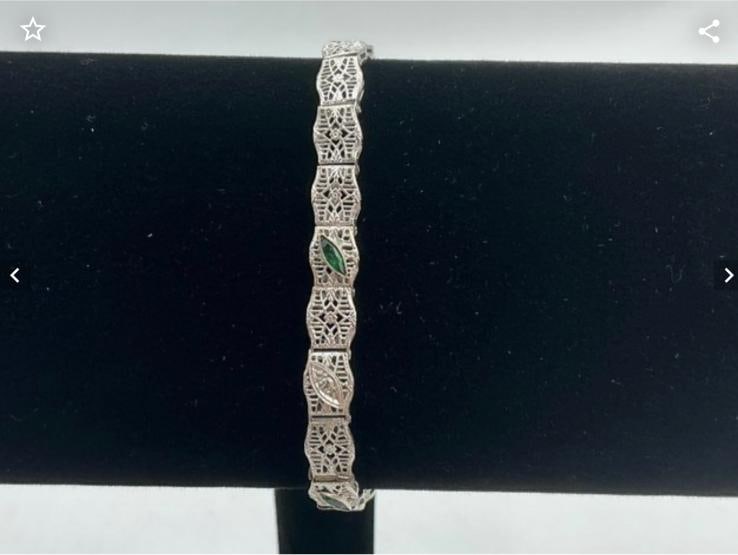 Ladies 10k Art Deco Bracelet: 10k white gold bracelet stamped and tested. Emerald accent stones. Weighs 6.0 grams.