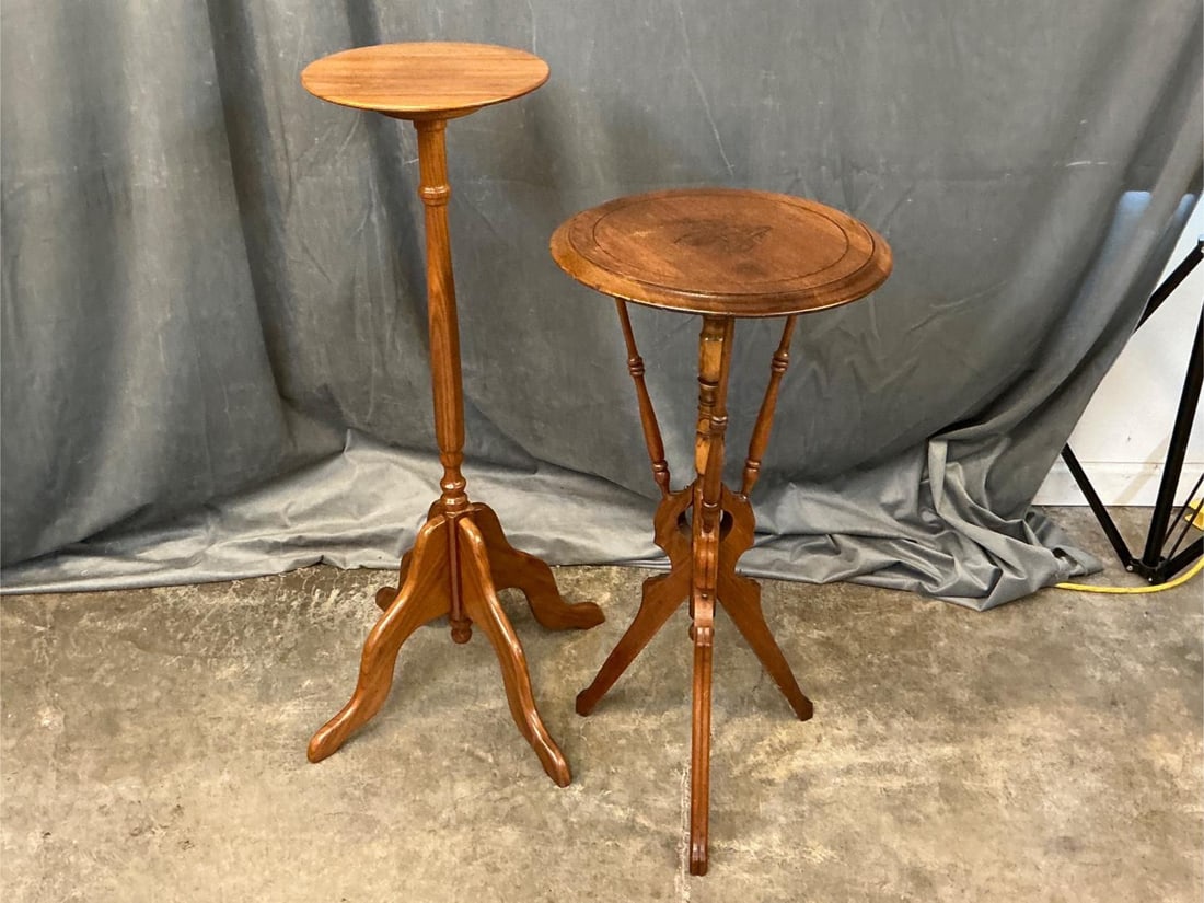 Wood Plant Stands: Lot of two vintage wooden plant stands. Shorter one has separated leg and has a shift. Tallest one measures 11.5 inches wide x 36.5 inches tall.