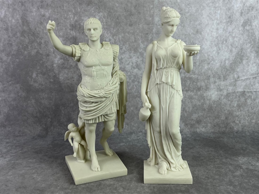 Veronese Design Statues: Augustus Caesar of Prima Porta and Hebe, the Greek Goddess of youth statues. Caesar is missing pointer finger but otherwise in good condition. Hebe measures 3.25 inches wide x 12 inches tall.