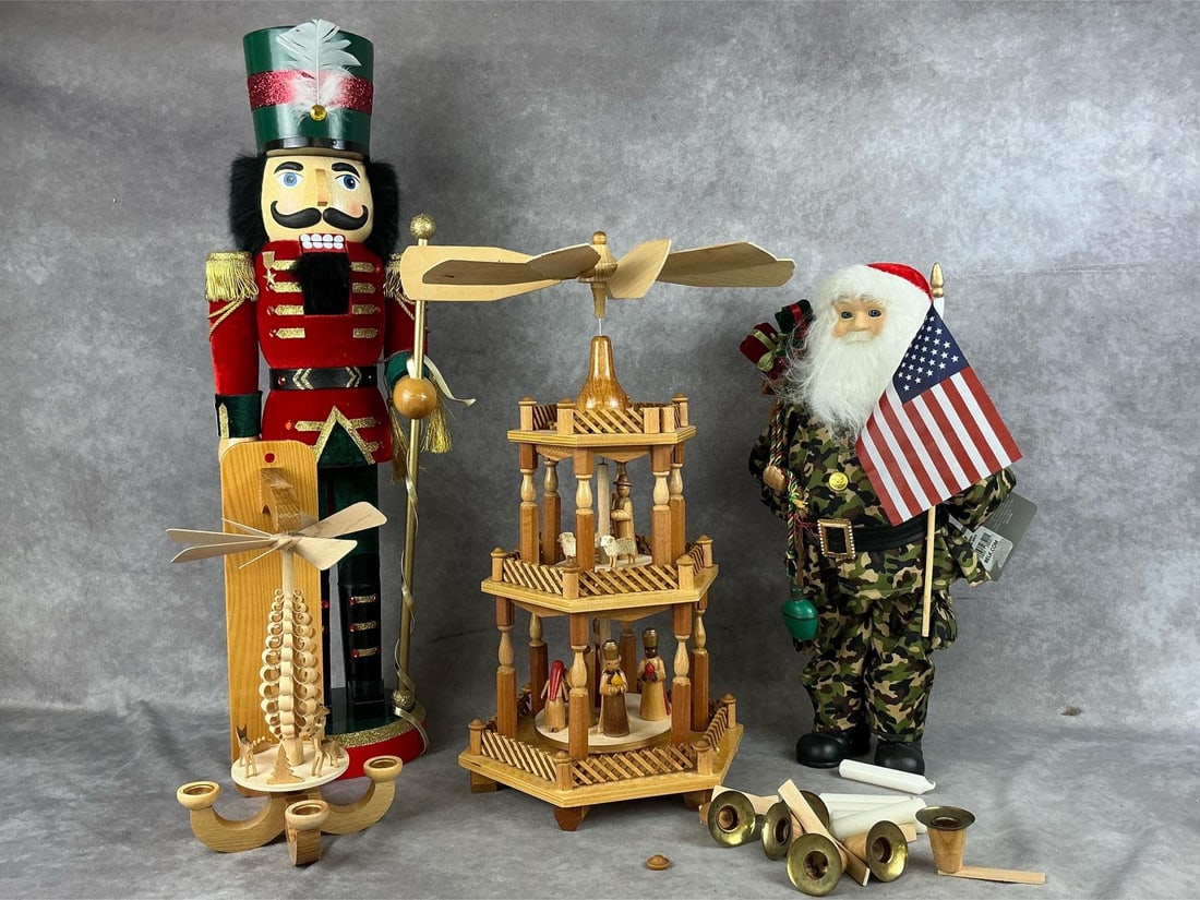 German Christmas Pyramids & Christmas Decor: One Lord and Taylor nutcracker with box, one military Santa with tag attached, one German Christmas pyramid that is missing parts and has broken pieces, and one a wall German pyramid, with a broken bl