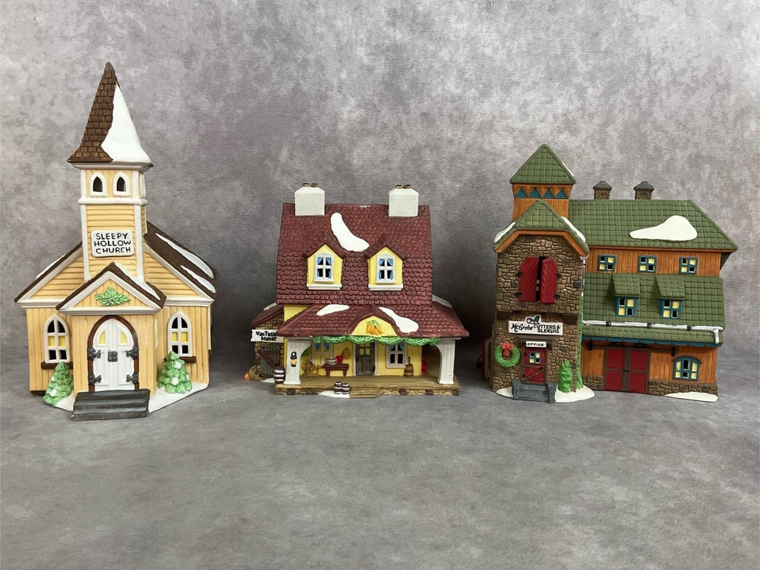 Department 56 Christmas Village: Three New England Village Series Christmas Village houses, made by Department 56. 1990 Sleepy Hollow Church and Van Tassel Manor, 1991 Mc Grebe Cutters and sleighs. All in original boxes and styrofoam