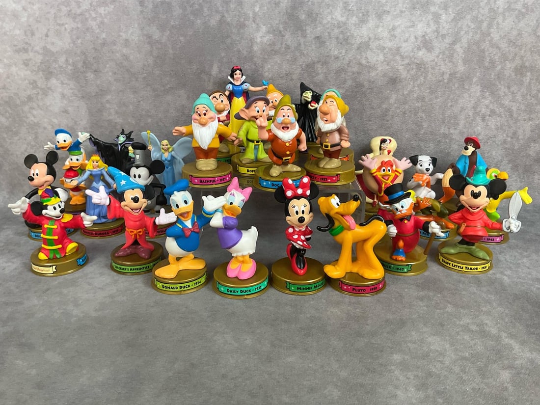 Disney McDonalds Toys: Twenty nine, 2002 McDonalds Disney Happy Meal toys. Characters include Mickey, Minnie, Snow White and the Seven Dwarfs, Aurora, and more. All in good condition. Tallest is 2 inches wide at base x 4.25
