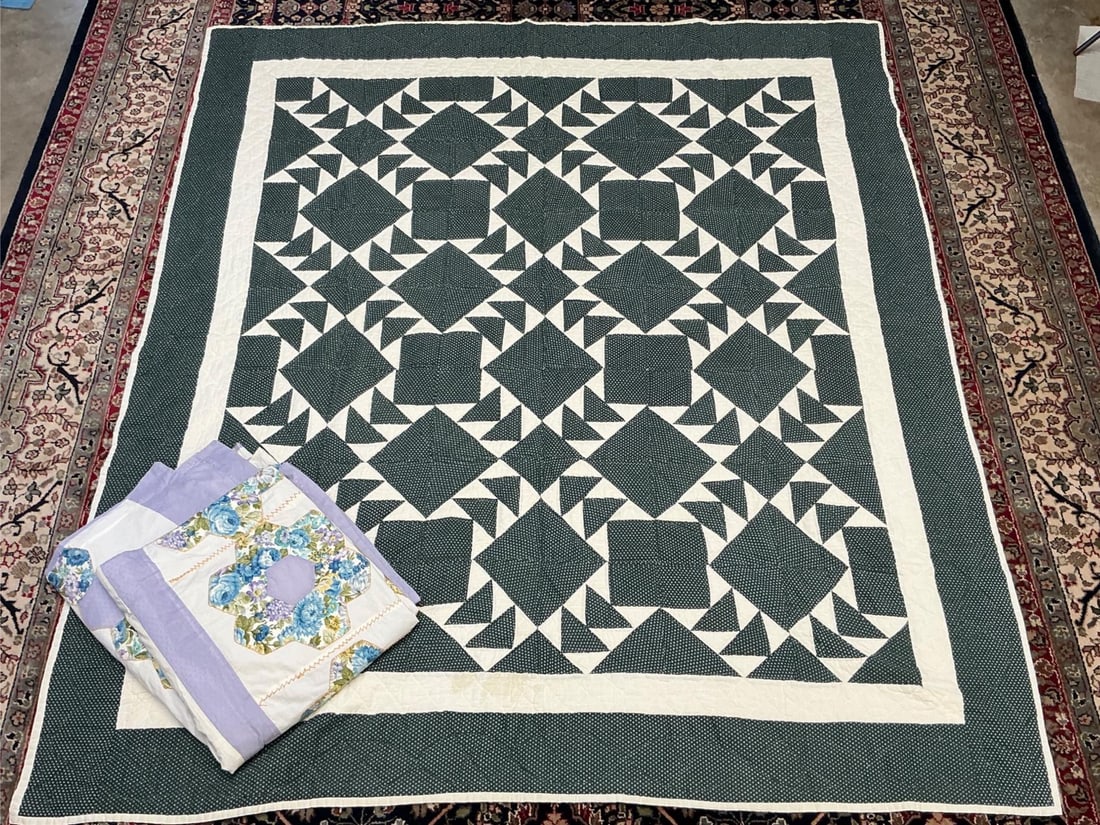 Handmade Quilts: Lot of two handmade quilts, one with lavender and floral patchwork and other one forest green with white. Both in good condition unclear on age. Largest measures 80 inches wide x 86 inches tall.