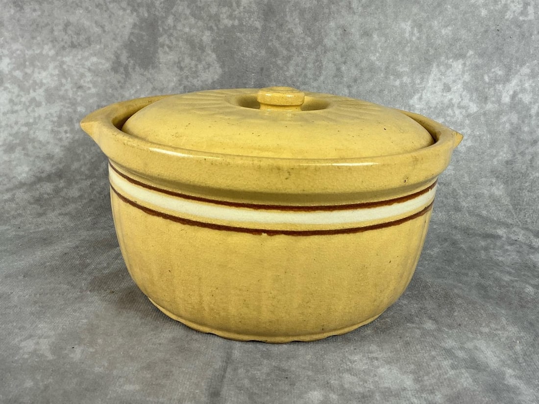 1920's Red Wing Saffronware Bean Pot: Stamped Pocahontas Dairy, Iowa on the bottom. Minor crazing and discoloration, otherwise good condition, measures 8 inches in diameter x 4 inches tall.