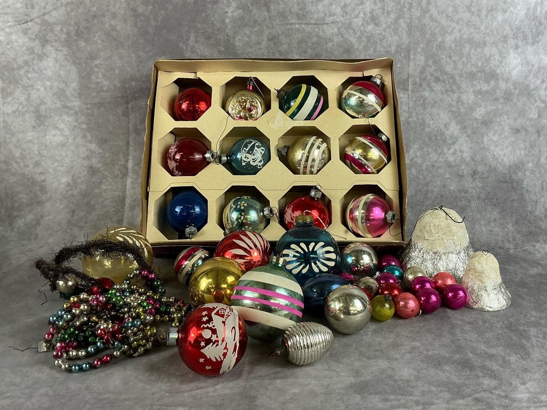 Vintage Christmas Ornaments: Assortment of Mercury glass ornaments and garland, handblown, Japan paper mâché, Shiny Brite, and Poland hand painted ornaments. All are in fair to good condition. Box of ornaments measures 12.5 inc
