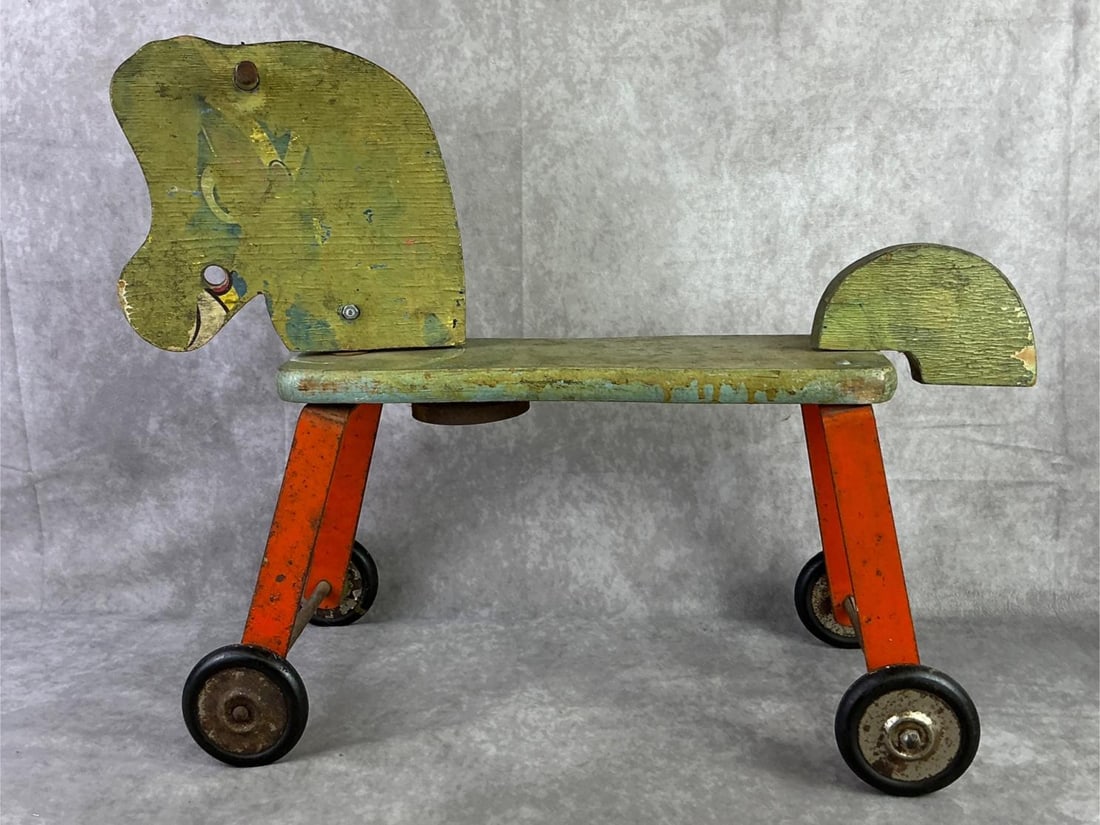 Gong Bell Toy Co.: Gong Bell Toy Co. USA riding horse with wheels. In fair condition with paint loss, missing parts, and rust. Horse measures 21.5 inches wide x 17 inches tall.