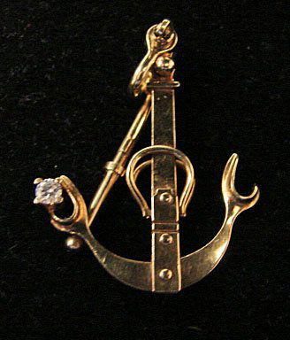 Ole Lynggaard Jewelry: Ole Lynggaard New Zealand rock anchor pendant with accent diamond (.10 cttw). In 18k yellow gold. Marked "OLEL 750 18k." Model# 810-4. 8.2 grams total weight. Comes with original Lynggaard tag. Origin