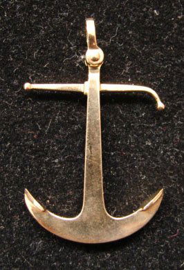 Ole Lynggaard Jewelry: Ole Lynggaard anchor brooch/pendant in 18k yellow gold. Marked "OLEL 750 18k." 9.8 grams total weight. Comes with original Lynggaard tag. Original retail $975.