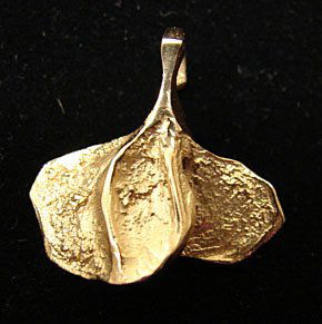 Ole Lynggaard Jewelry: Ole Lynggaard small leaf pendant. 18k yellow gold. Marked on back "OLEL 750 18k." Model # 734-1. 2.6 grams. Comes with original Lynggaard tag. Original retail price $275.