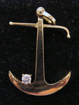 Ole Lynggaard Jewelry: Ole Lynggaard anchor brooch/pendant in 18k yellow gold. Marked "OLEL 750 18k." 10.3 grams total weight. Comes with original Lynggaard tag. Original retail $1,775.