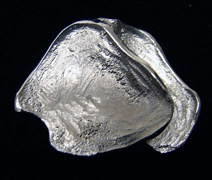 Ole Lynggaard Jewelry: Ole Lynggaard leaf pendant. 18k white gold. Marked on back "OLEL 750 18k." Model# 668-1. 9.0 grams. Comes with original Lynggaard tag. Original retail price $825