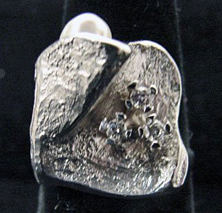 Ole Lynggaard Jewelry: Ole Lynggaard leaf ring in 18k white gold. Ring has three accent diamonds (.12cttw) and natural oblong pearl. Marked "OLEL 750 18k." 10.7 grams total weight. Comes with original Lynggaard tag.