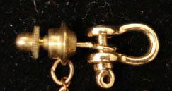 Ole Lynggaard Jewelry: Ole Lynggaard working shackle tie tack in 18k yellow gold. Marked "OLEL 750 18k." Model# 822-4. The shackle and post are 2.8 grams total weight. Comes with original Lynggaard tag. Original retail $290