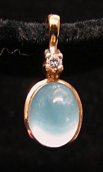 Ole Lynggaard Jewelry: Ole Lynggaard aquamarine (.65cttw) and diamond (.05cttw) 18k yellow gold pendant. Marked "OLEL 750 18k." Model# 575-4. 3.0 grams total weight. Comes with original Lynggaard tag. Original retail $450.