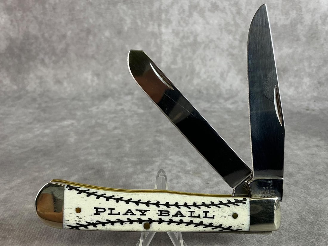 Case XX Natural Bone Play Ball Trapper: Item No. AWTC54PB. Sports Series Natural Bone Play Ball Two Blade Trapper. Never sharpened or carried, tight snap. Comes with box. In good condition. Measures 4.25 inches, closed. Play Ball is etched